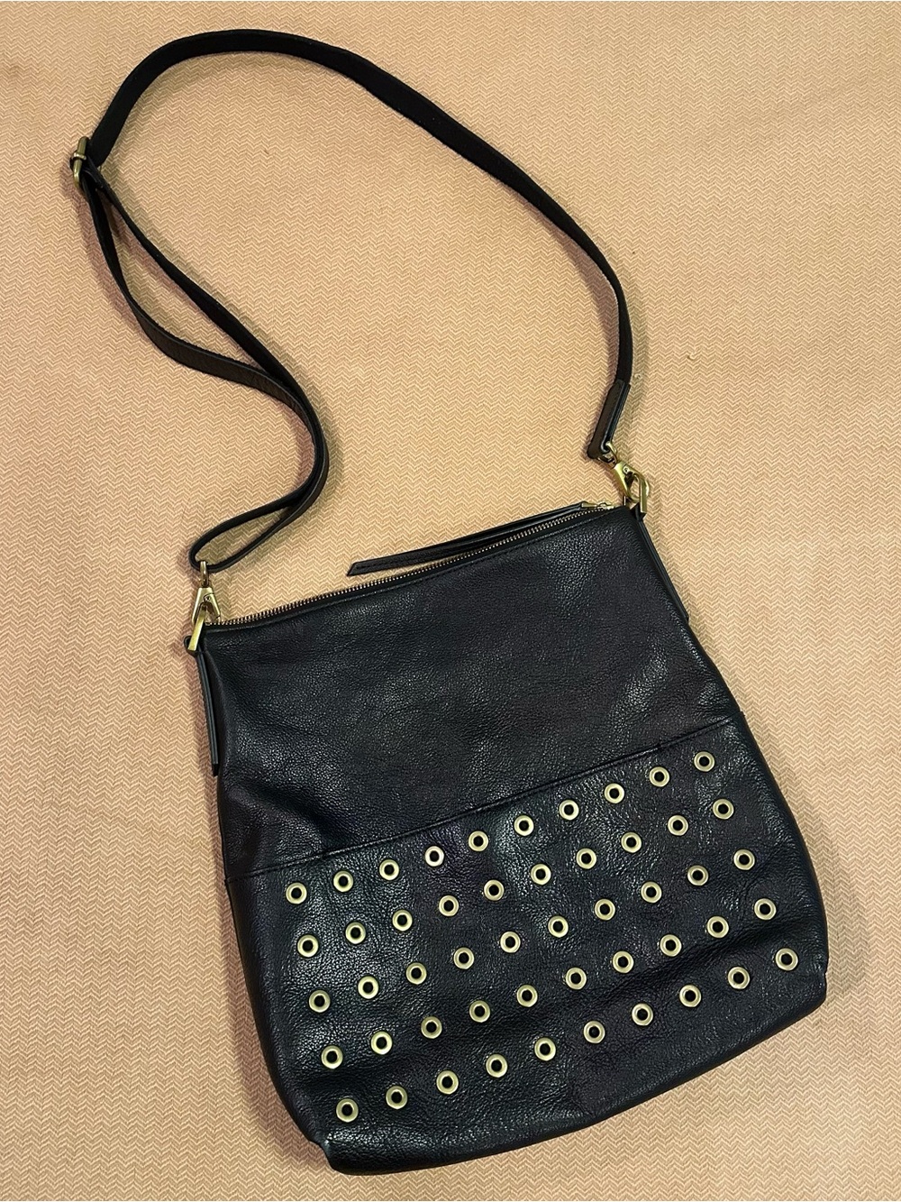 Fossil leather purse with grommets